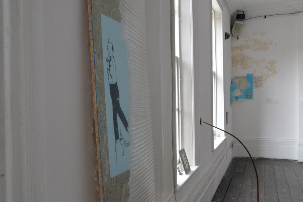 A shadow of a woman who caresses two horses&nbsp;faces